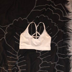 white nike strapped sports bra